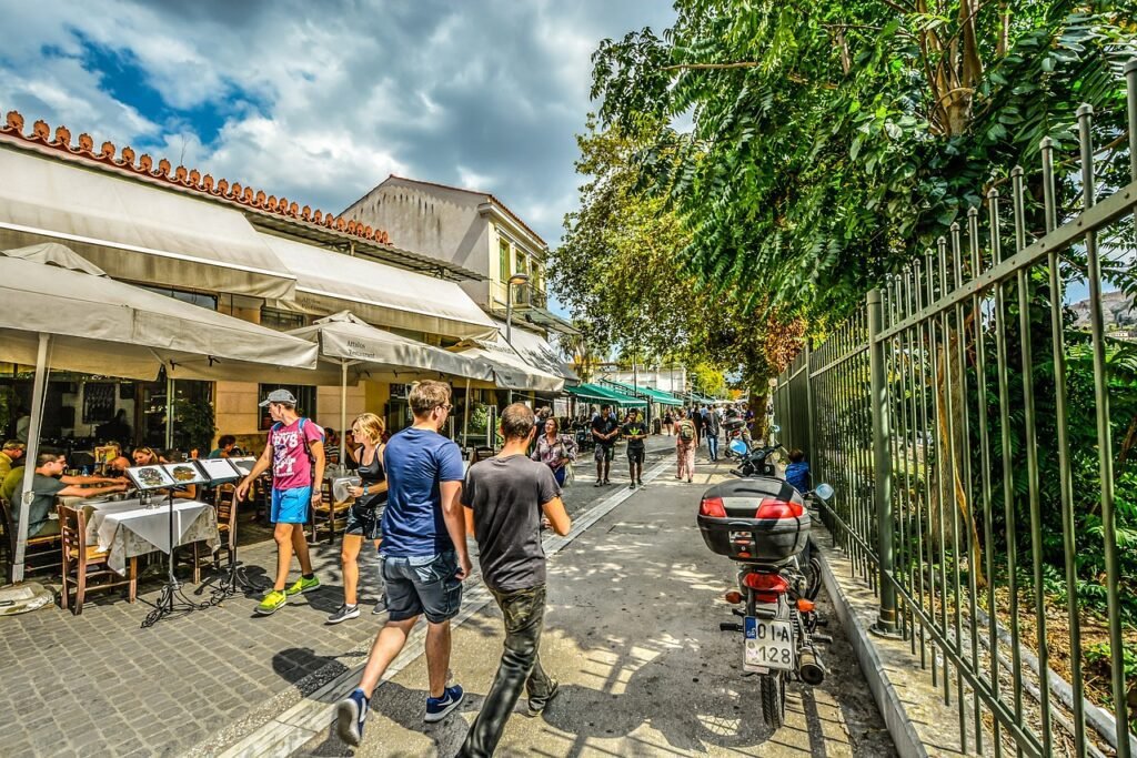 Plaka Neighborhood: A vibrant street scene in Plaka, showcasing local cafes and shops.