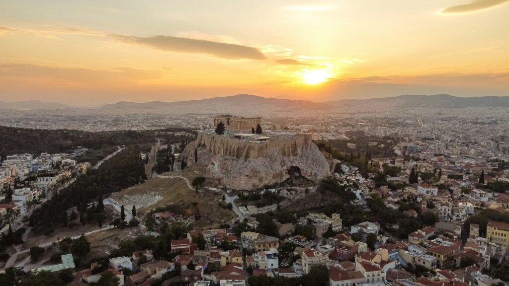 A panoramic view of the Acropolis and the Parthenon at sunrise.
